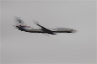 An aircraft lands, photographed at Berlin Brandenburg Airport 'Willy Brandt'Äô (BER) in Schönefeld,