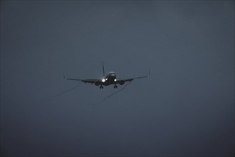 An aircraft lands at blue hour, taken at Berlin Brandenburg Airport 'Willy Brandt'Äô (BER) in