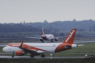 Two aircraft of the low-cost airline easyjet, photographed at Berlin Brandenburg Airport 'Willy