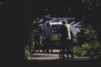 A woman with a rollator, photographed in Berlin, 07/08/2024