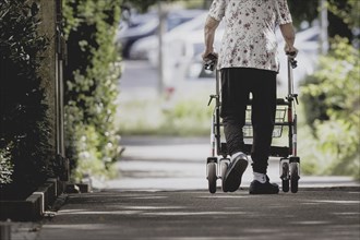 A woman with a rollator, photographed in Berlin, 07/08/2024