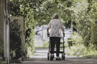 A woman with a rollator, photographed in Berlin, 07/08/2024