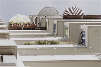 Parasols on the balcony of a prefabricated building, taken in Berlin, 07/08/2024