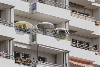 Parasols on the balcony of a prefabricated building, taken in Berlin, 07/08/2024