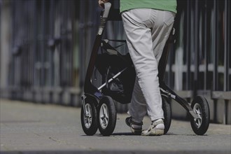 A woman with a rollator, photographed in Berlin, 07/08/2024