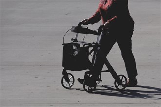 A woman with a rollator, photographed in Berlin, 07/08/2024