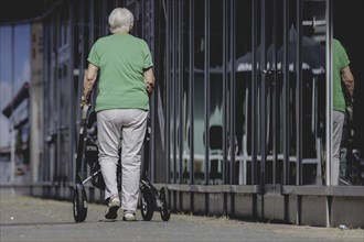 A woman with a rollator, photographed in Berlin, 07/08/2024