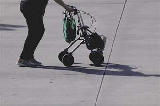 A woman with a rollator, photographed in Berlin, 07/08/2024