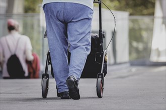 A woman with a rollator, photographed in Berlin, 07/08/2024