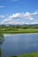 Landscape of Danubia river with reflection of the landscape and Clouds, Castle of Wörth an der