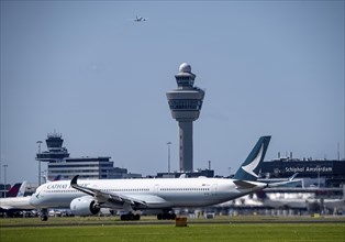 Aircraft at Amsterdam Schiphol Airport, taking off on the Aalsmeerbaan, 18L/36R, Cathay Pacific