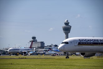 Aircraft at Amsterdam Schiphol Airport, on the taxiway for take-off on the Aalsmeerbaan, 18L/36R,