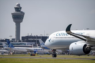 Cathay Pacific aircraft at Amsterdam Schiphol Airport, shortly in front of take-off on the