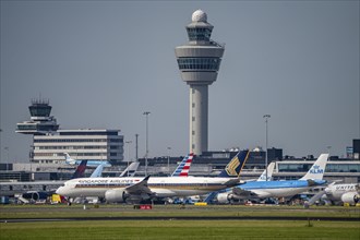 Aircraft at Amsterdam Schiphol Airport, taxiway, apron, air traffic control tower, terminal,