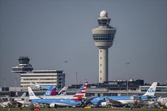 Aircraft at Amsterdam Schiphol Airport, taxiway, apron, air traffic control tower, terminal,