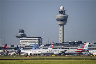 Aircraft at Amsterdam Schiphol Airport, taxiway, apron, air traffic control tower, terminal,