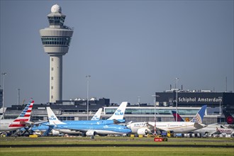 Aircraft at Amsterdam Schiphol Airport, taxiway, apron, air traffic control tower, terminal,