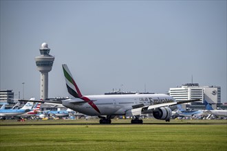 Emirates Boeing 777-31H, aircraft landing at Amsterdam Schiphol Airport, Buitenveldertbaan, 09/27,