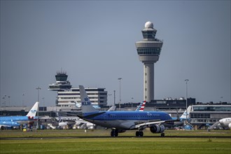 KLM Embraer E190STD aircraft landing at Amsterdam Schiphol Airport, Buitenveldertbaan, 09/27, Air