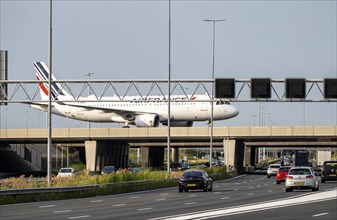 Amsterdam Schiphol Airport, Air France Airbus A320 aircraft on the taxiway, bridge over the A4