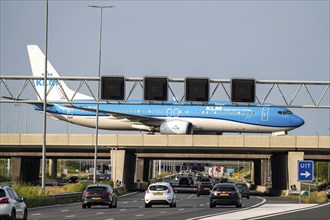 Amsterdam Schiphol Airport, KLM Boeing 737 aircraft on the taxiway, bridge over the A4 motorway,