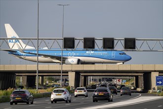 Amsterdam Schiphol Airport, KLM Boeing 737 aircraft on the taxiway, bridge over the A4 motorway,