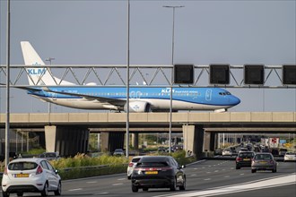 Amsterdam Schiphol Airport, KLM Boeing 737 aircraft on the taxiway, bridge over the A4 motorway,