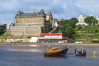 RNLI Scarborough Lifeboat Station and boat over Scarborough Beach, Scarborough, North Yorkshire,