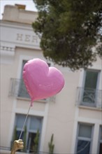 A heart-shaped balloon floats in the air, Saint Tropez, Provence-Alpes-Côte d'Azur, France, Europe