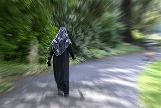 Wiping picture woman with headscarf