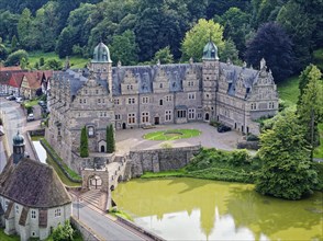 Aerial view of Hämelschenburg Castle, built in the Weser Renaissance style, with gardens, pond and