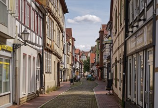 Town centre of Hameln, Neue Marktstrasse, with cobblestones and historic half-timbered houses.