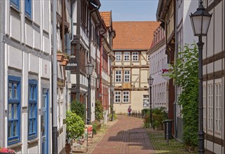 Hameln town centre, Hummenstrasse, with cobblestones and restored old half-timbered houses. Hameln,