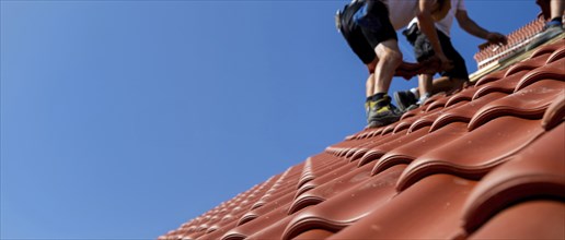 Panoramic image of the roof covering of a new tiled roof on a residential building