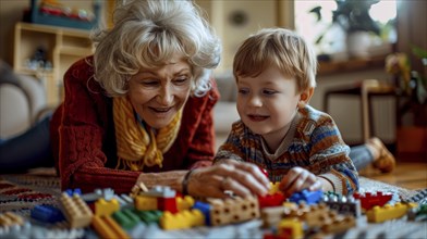 An elderly woman and her young grandson happily building structures with colorful blocks in a cozy