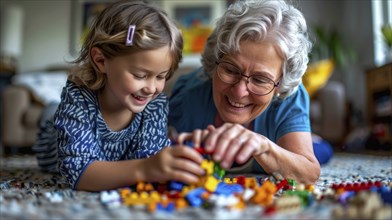 An elderly woman and her young granddaughter happily engaged in playing with colorful blocks