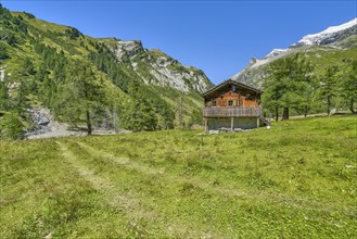 Alpine hut in the Kalser Tauern, blue sky, snow-covered mountains, Dorfertal, Hohe Tauern National