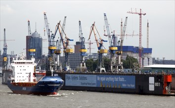 Hamburg, 19.06.2009, Ship passes the Blohm & Voss shipyard in Hamburg harbour, Hamburg, Germany,