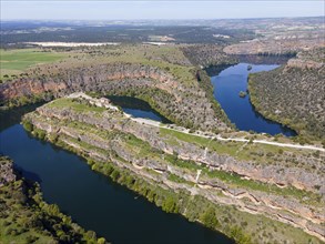 Spectacular view of a river running through deep gorges and lush vegetation, bird's eye view,