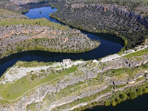 River winding through impressive gorges surrounded by dense vegetation and rocky terrain, aerial