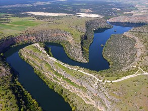 Picturesque river running through dramatic gorges and surrounded by dense vegetation and green