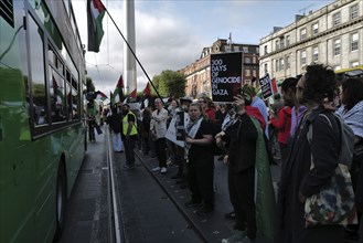 Dublin, Ireland. A Dublin bus passes close to protesters during a pro-Palestine protest in