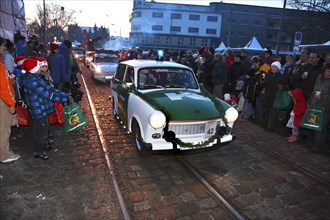 Parade of Father Christmases and Trabant drivers at the Father Christmas Parade in Brandenburg an