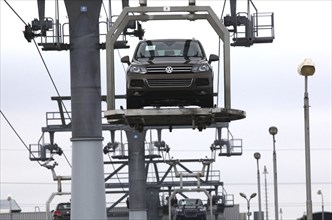 Bratislava, 05.10.2010, VW Touareg sport-utility vehicles are carried by a lift from an assembly