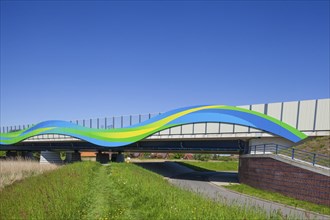 Colourfully painted motorway bridge with noise barrier over the river Este, Buxtehude, Altes Land,