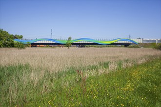 Colourfully painted motorway bridge with noise barrier over the river Este, Buxtehude, Altes Land,