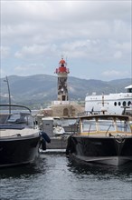 The lighthouse of Saint Tropez, in front of it motorboats, Saint Tropez, Provence-Alpes-Côte