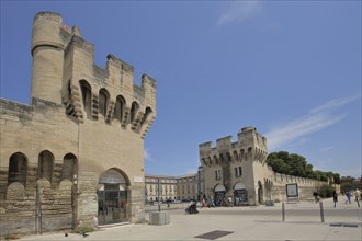 Historic city wall with defence towers and pedestrians, city fortifications, defence defence tower,