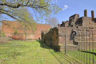 Casimir castle built in 1934 and imperial palace, child, climbing, bars, metal fence,