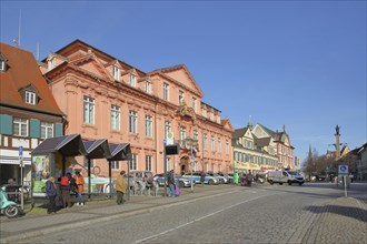 Historic royal court built in 1717 and bus stop with people, police building, main street,